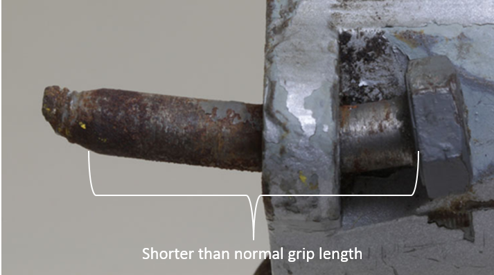 Figure 30: One of the non-standard upper attachment bolts fitted to VH-TSG showing the shorterthannormal grip length